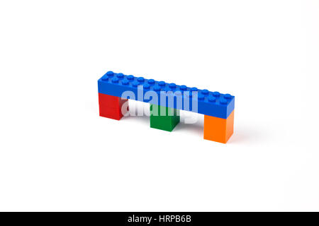 Blue bridge or viaduct model of Lego bricks or pieces resting on three piers. Stock Photo