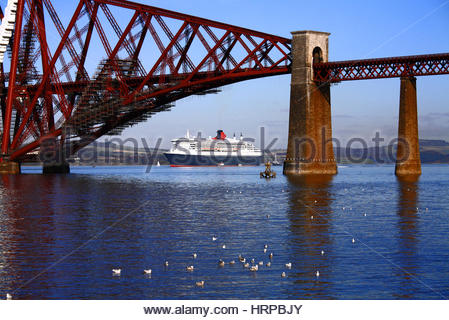 Cruise Liner Queen Mary 2 anchored beneath the Forth Bridge, Scotland Stock Photo