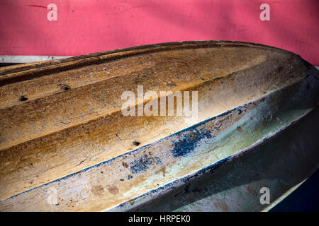 Row boat upturned at  the Devon village of Stoke Gabriel South Hams Devon,multi coloured hull, Stock Photo