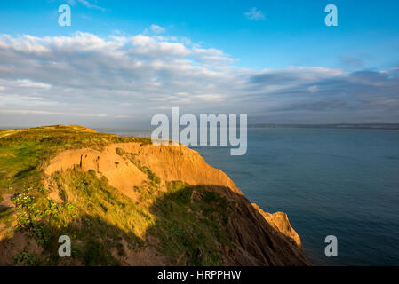 Evening sunlight on the cliffs at Filey Brigg at Filey on the coast of North Yorkshire, England. Stock Photo