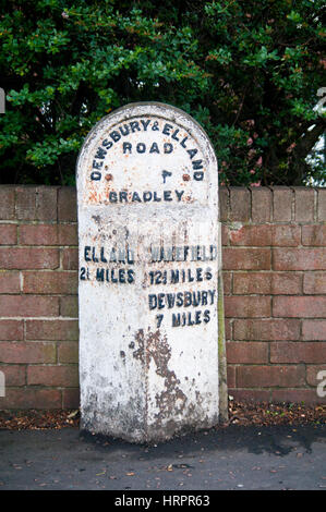 Old weathered stone marker milestone on Thruxton Village green engraved ...