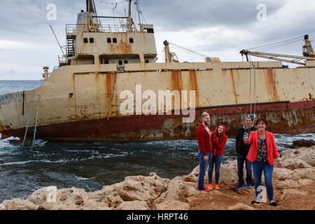 Tourists taking a selfie at the wreck of the Edro III, Pegeia, near Paphos, Cyprus Stock Photo