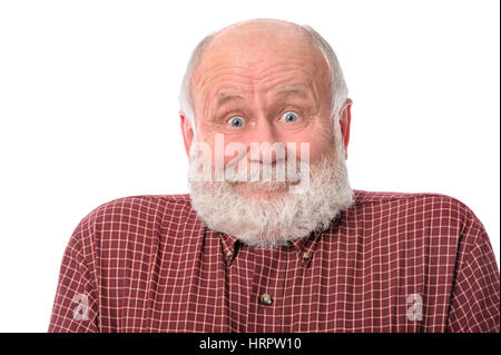 Handsome bald and bearded senior man shows surprised smile grimace or facial expression, isolated on white background Stock Photo