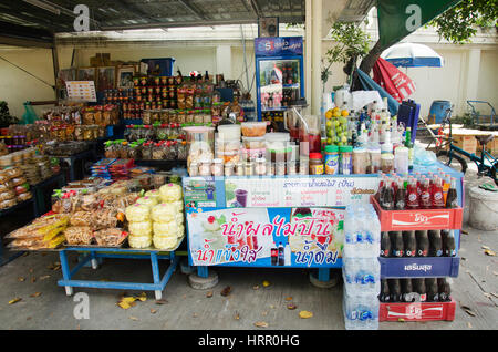 Thai people owner sale food drink product and souvenir for travelers people at local shop in Wat Muang temple on January 25, 2017 in Ang Thong, Thaila Stock Photo