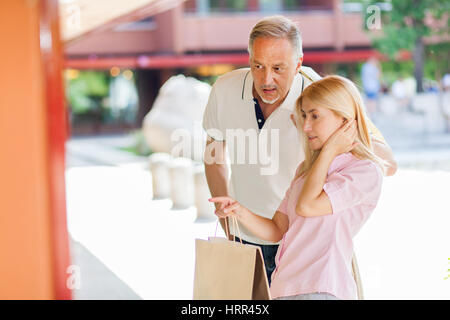 Adult couple shopping outdoor Stock Photo