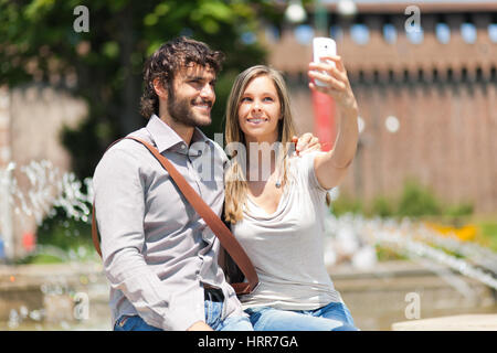 Couple of turists taking a selfie in the city Stock Photo