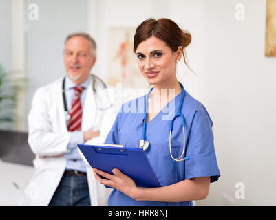 Smiling doctors in a clinic Stock Photo