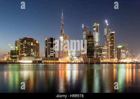 DUBAI, UAE - NOV 27, 2016: The Dubai Business Bay skyline illuminated at night. United Arab Emirates, Middle East Stock Photo