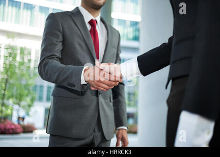 Handshake between business people Stock Photo