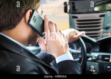 Man talking on the phone while driving Stock Photo