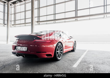 Kyiv, Ukraine - August 7th, 2016: Photoshoot of red Porsche 911 near automotive center 'Porsche Center Kyiv Airport' Stock Photo