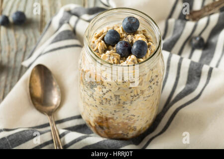 Healthy Homemade Overnight Oats Oatmeal with Chia and Peanut Butter Stock Photo