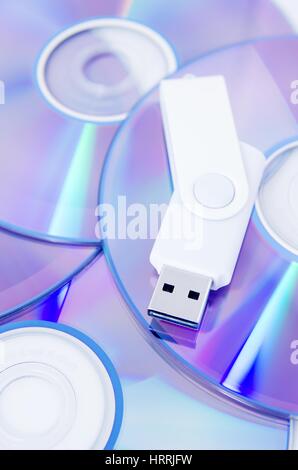 DVD disc and USB flash drive on white background Stock Photo