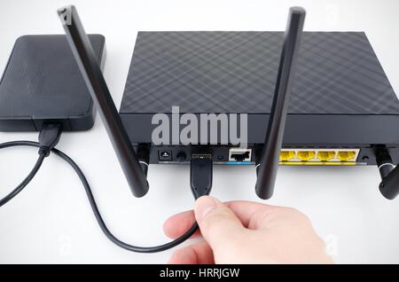 Router with backup storage disk. DLNA media server from USB disk Stock Photo