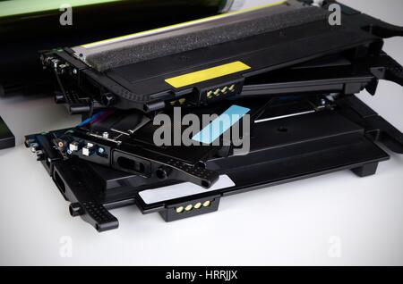 Toner cartridge set for laser printer. Computer supplies on white background. Stock Photo