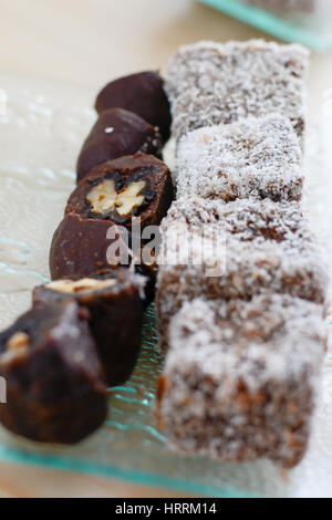 Colorful and delicious home made chocolate cakes arranged on glass plate for celebration of the Saint day Stock Photo