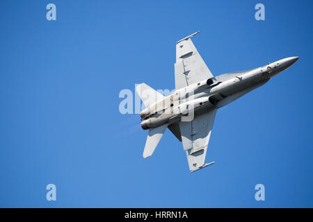 MELBOURNE, AUSTRALIA - MARCH 14: An Royal Australian Air Force FA18A Hornet performs in a public display above Melbourne on March 14, 2015 Stock Photo