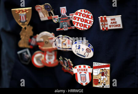 Stoke City badges on a fans top before the Premier League match at the bet365 Stadium, Stoke. PRESS ASSOCIATION Photo. Picture date: Saturday March 4, 2017. See PA story SOCCER Stoke. Photo credit should read: Mike Egerton/PA Wire. RESTRICTIONS: EDITORIAL USE ONLY No use with unauthorised audio, video, data, fixture lists, club/league logos or 'live' services. Online in-match use limited to 75 images, no video emulation. No use in betting, games or single club/league/player publications. Stock Photo