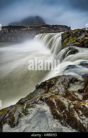 Thjofafoss or thieves falls waterfall with Mt Burfell on an overcast day in Autumn, Central Iceland Stock Photo