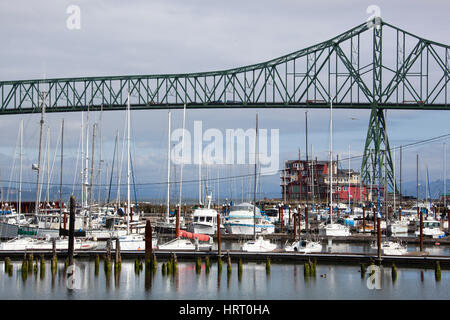 The view of Astoria town marina with Astoria-Megler Bridge over Columbia River (Oregon). Stock Photo