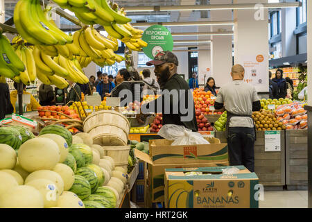 A shopper is seen in the fruit and vegetables section of a supermarket ...