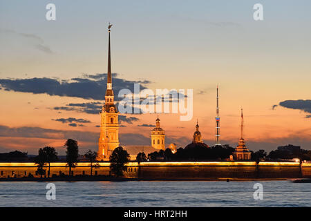 Peter and Paul fortress view from the Palace embankment of the Neva river at sunset during the white nights in St. Petersburg. On the background of th Stock Photo