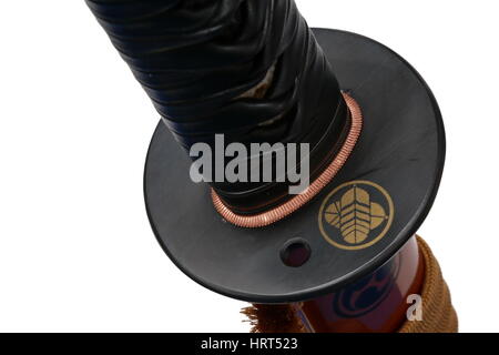 Tsuba : hand guard of Japanese sword with white background Stock Photo