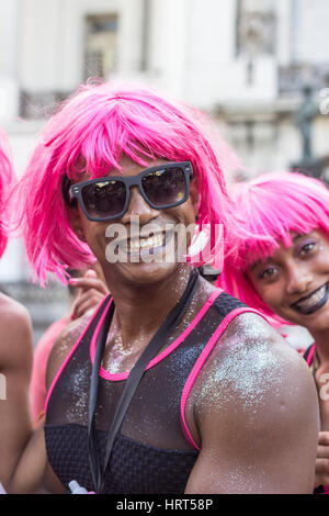 FEBRUARY 8, 2016 - Rio de Janeiro, Brazil - Yonge people of African descent wearing pink costume and smiling during Carnival street parade Stock Photo