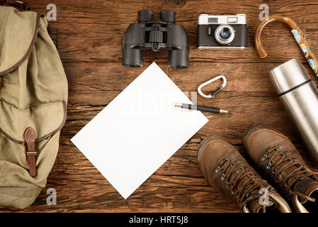 Equipment for mountaineering and hiking on wooden background Stock Photo