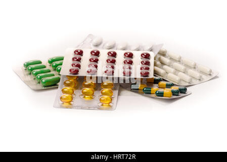 Capsules and pills packed in blisters on white background Stock Photo