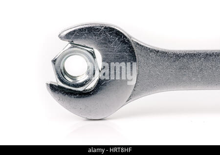 Wrench and nut on white background Stock Photo