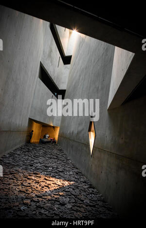 Berlin. Germany. Jewish Museum. Shalekhet (Fallen Leaves) art installation in the Memory Void, by Israeli artist Menashe Kadishman consists of over 10 Stock Photo