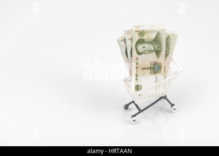 1 Yuan bills / banknotes in shopping cart / trolley against light background. Metaphor for Chinese economy, budget, spending power, consumer spending. Stock Photo