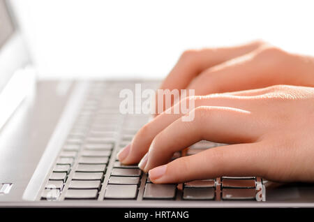Close-up of typing female hands Stock Photo