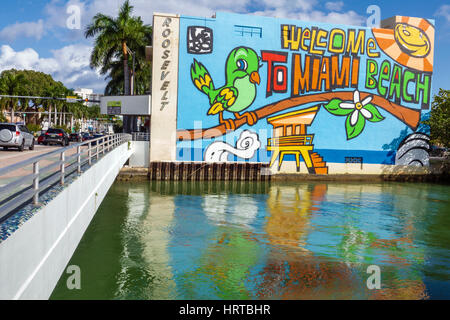 Miami Beach Florida,41st Street Arthur Godfrey Road,bridge,canal,mural,welcome,Roosevelt Theater,water,canal,Biscayne FL170112017 Stock Photo