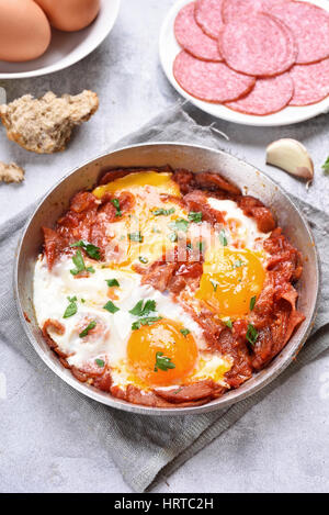 Fried eggs with bacon in frying pan. Dish for breakfast Stock Photo