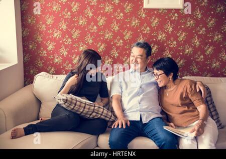 Asian family having fun in the living room together Stock Photo