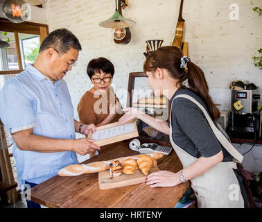 Small bakery business buying customer Stock Photo