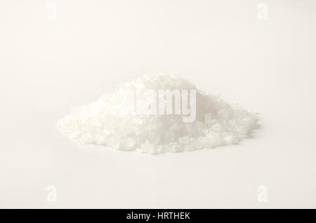 pile of coarse grained salt on white background Stock Photo - Alamy
