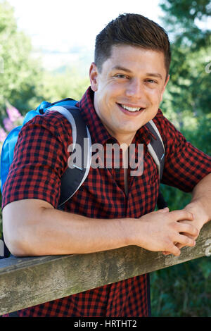 Portrait Of Young Man Hiking In Countryside Stock Photo