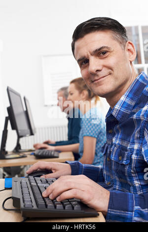 Mature Man Attending Computer Class Stock Photo