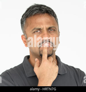 Adult man touching his face thoughtful gesture Stock Photo