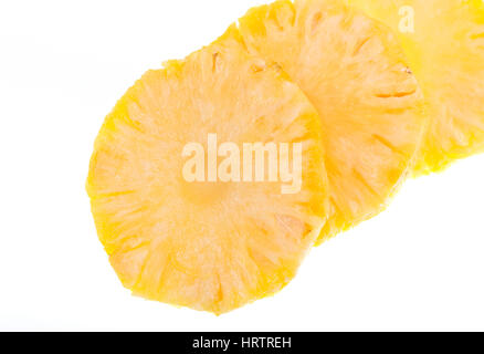 Slices of a pineapple (Ananas comosus) on a white background. Stock Photo