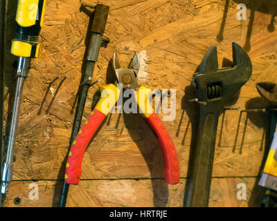 the old tools on shelf in the garage Stock Photo