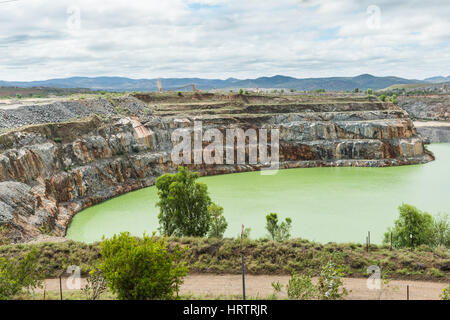 Open cut gold mine pit no longer used and full of water at Ravenswood, Queensland, Australia Stock Photo