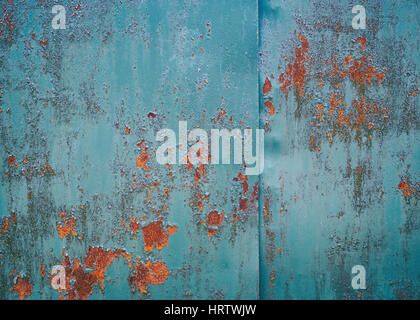 Vintage background. Old iron sheet painted in blue paint. The paint peeled off. in the ability to make some places rusty sheet. Traces of rust in seve Stock Photo