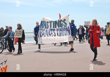 People take part in an Anti Austerity march at Hastings in East Sussex, England on May 30, 2015. Stock Photo