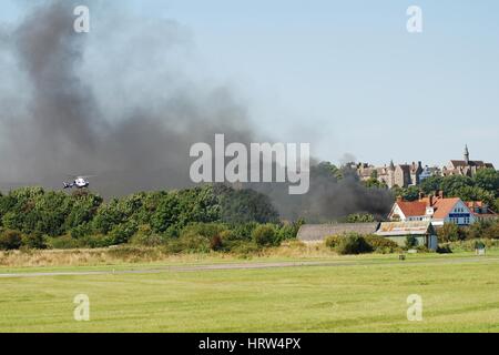 The Kent and Sussex Air Ambulance landing after the fatal crash of a Hawker Hunter fighter jet at the Shoreham airshow on August 22, 2015. Stock Photo