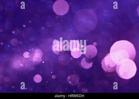 Purple bokeh or violet bokeh abstract background caused by spray water. Stock Photo