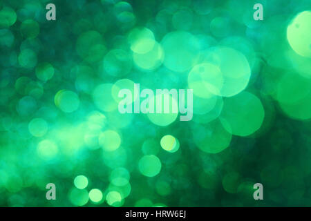 Dark green bokeh abstract background caused by spray water. Stock Photo